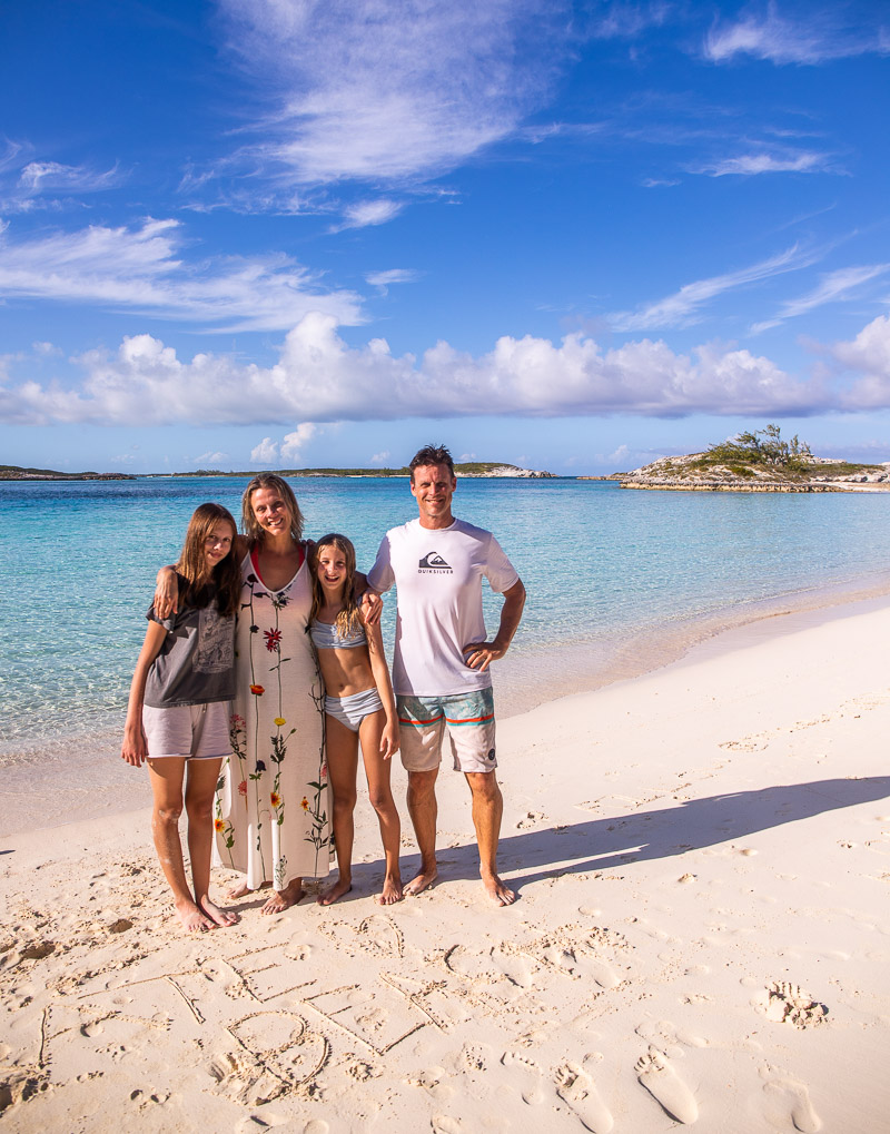 Family getting a photo at the beach