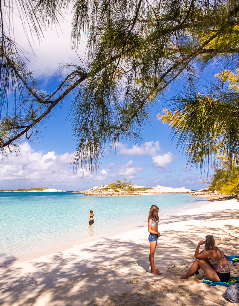 Mom and daughters relaxing on a beach