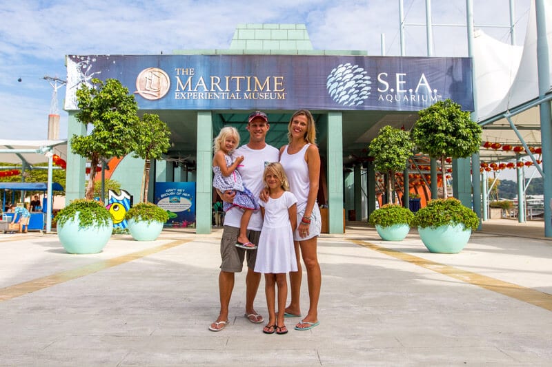 family posing in front of S.E.A Aquarium on Sentosa Island 