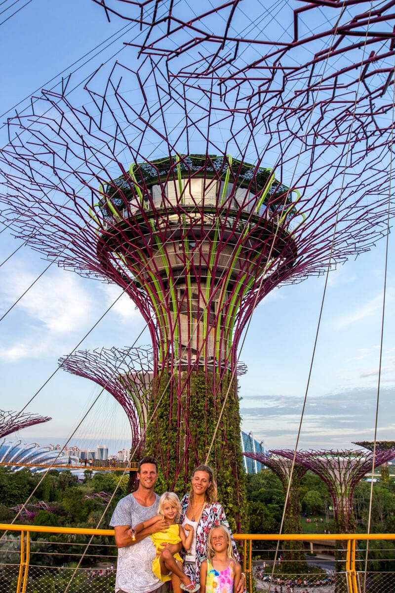 family posing in front of Supertree Grove 