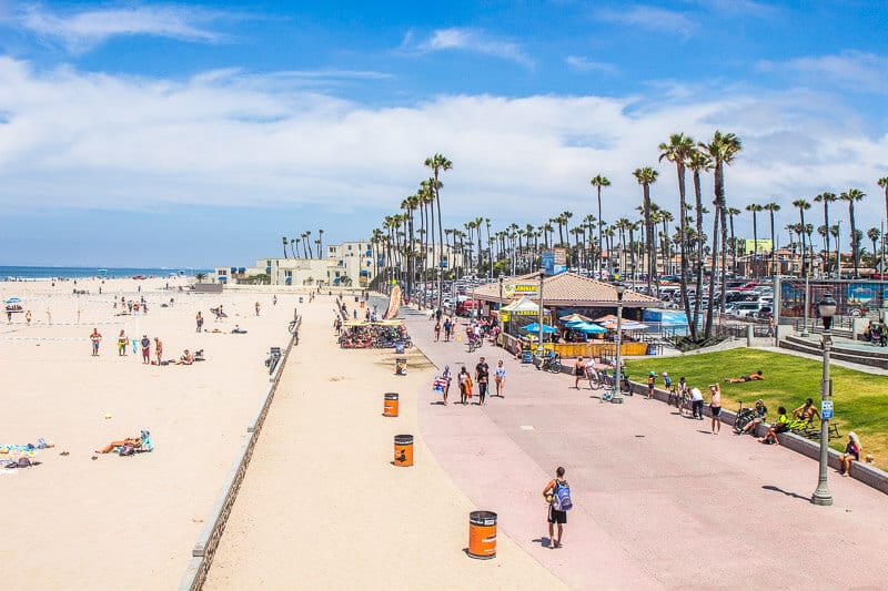 People walking along a beach boardwalk