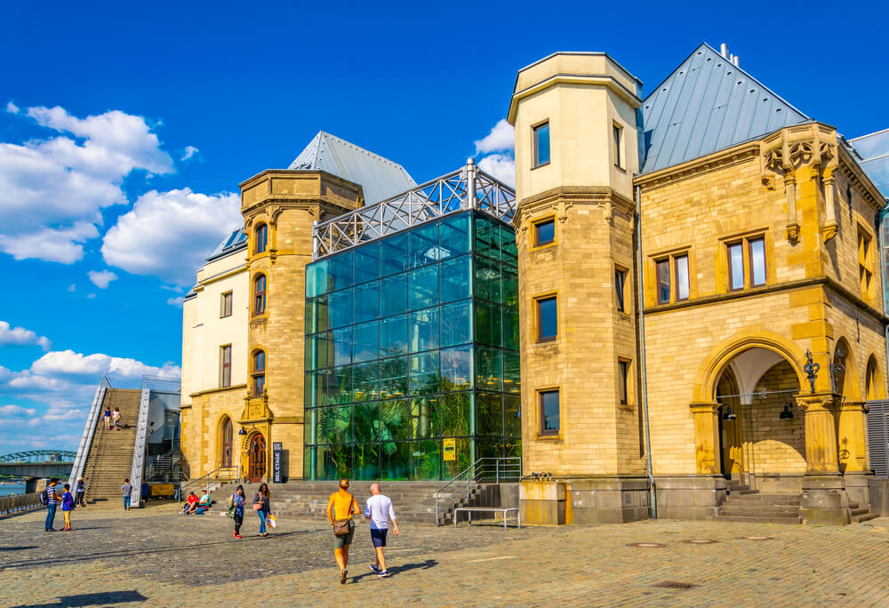 people walking past chocolate museum