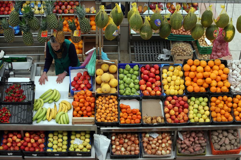 woman selling fruit in stall