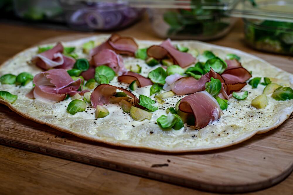 Flammkuchen on wooden board