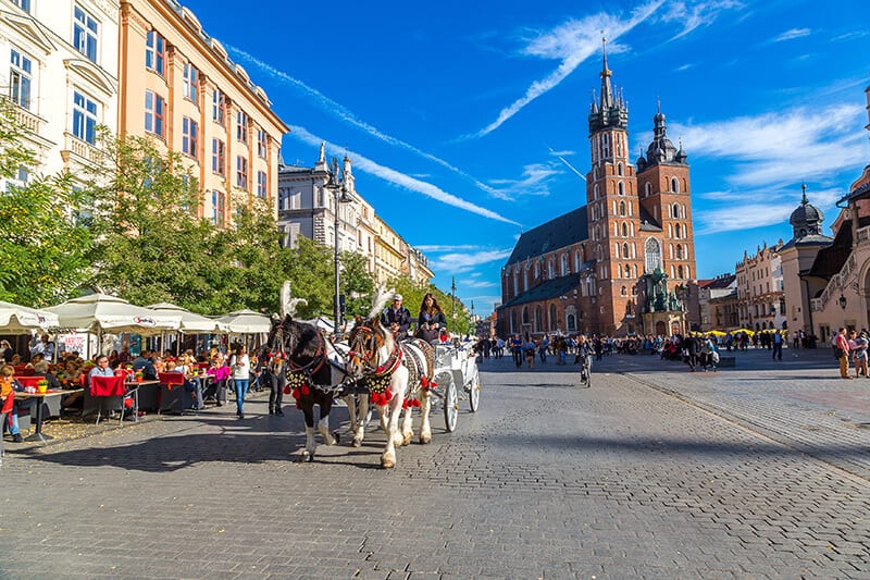 horse and carriange riding through medieval town