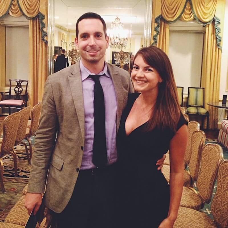 a couple posing for camera at the millionairre magician