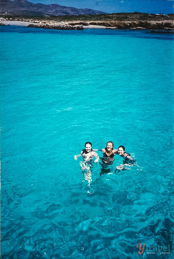 three women swimming in the The Blue Lagoon Paros Island Greece