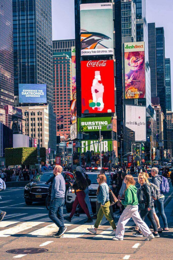 people crossing street in Time Square