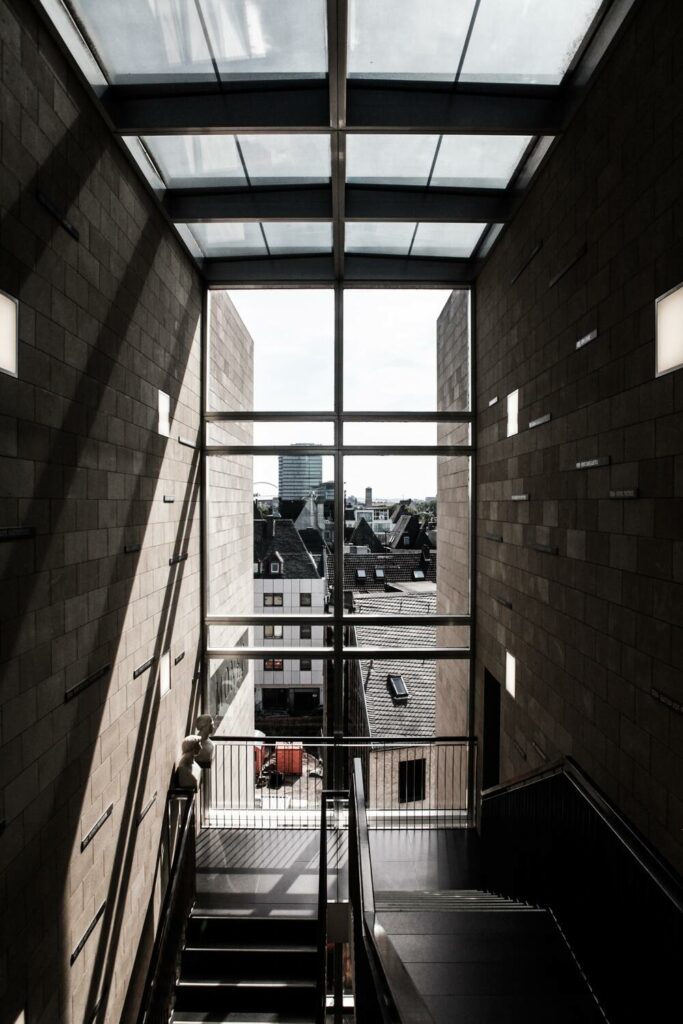 stairwell with view of city out window