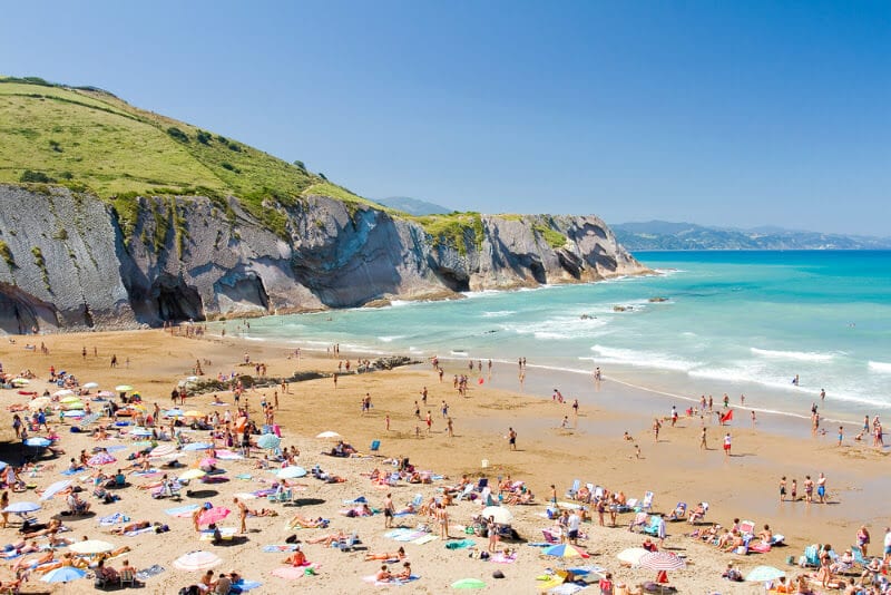 Beach in Zumaia with people on it