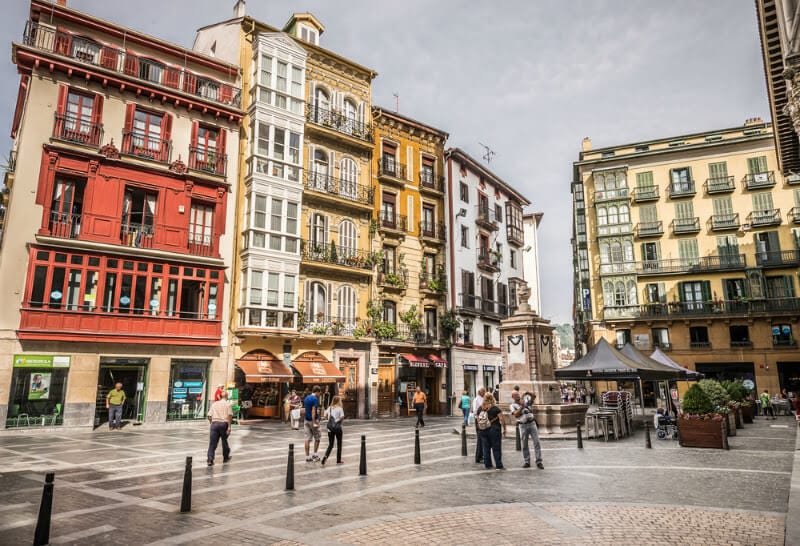 peopel walking in square outside Cathedral of Santiago, Bilbao. 