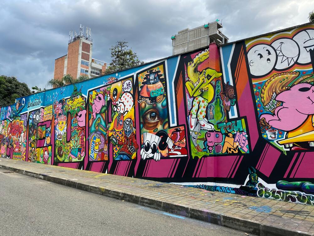 large mural on the wall in comuna 13