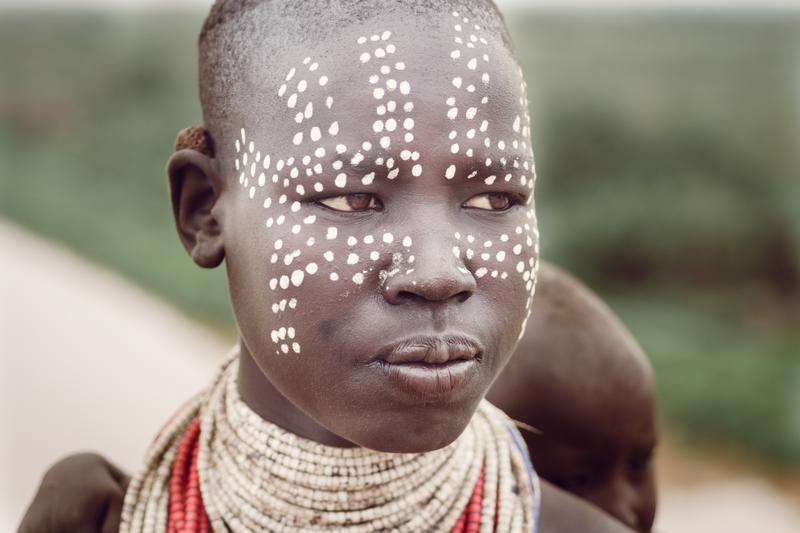 a woman wearing face paint