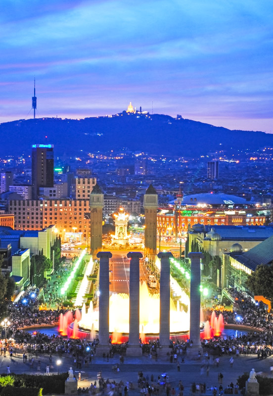 Fountains and historic columns and the mountain of Tibidabo