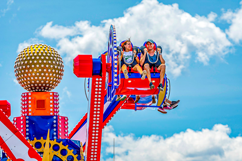 people on flying ride at luna park coney island