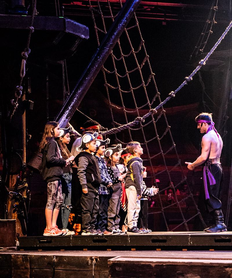 Kids on stage at a pirate show