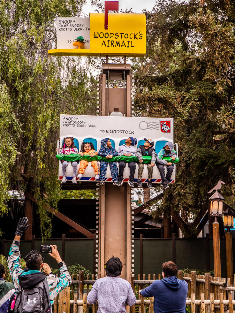 Young kids on a ride at a theme park