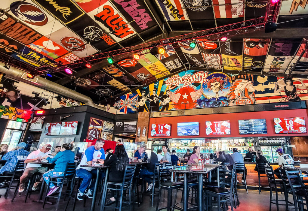 People dining in a rock and roll themed restaurant.