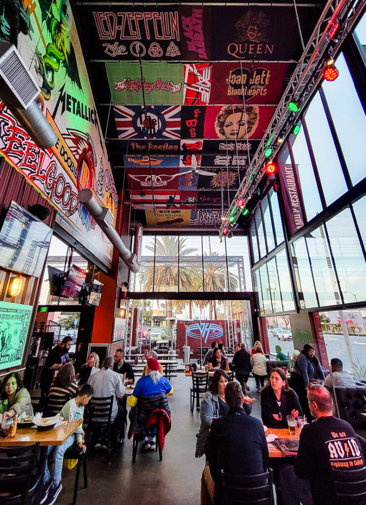 People dining in a rock and roll themed restaurant.