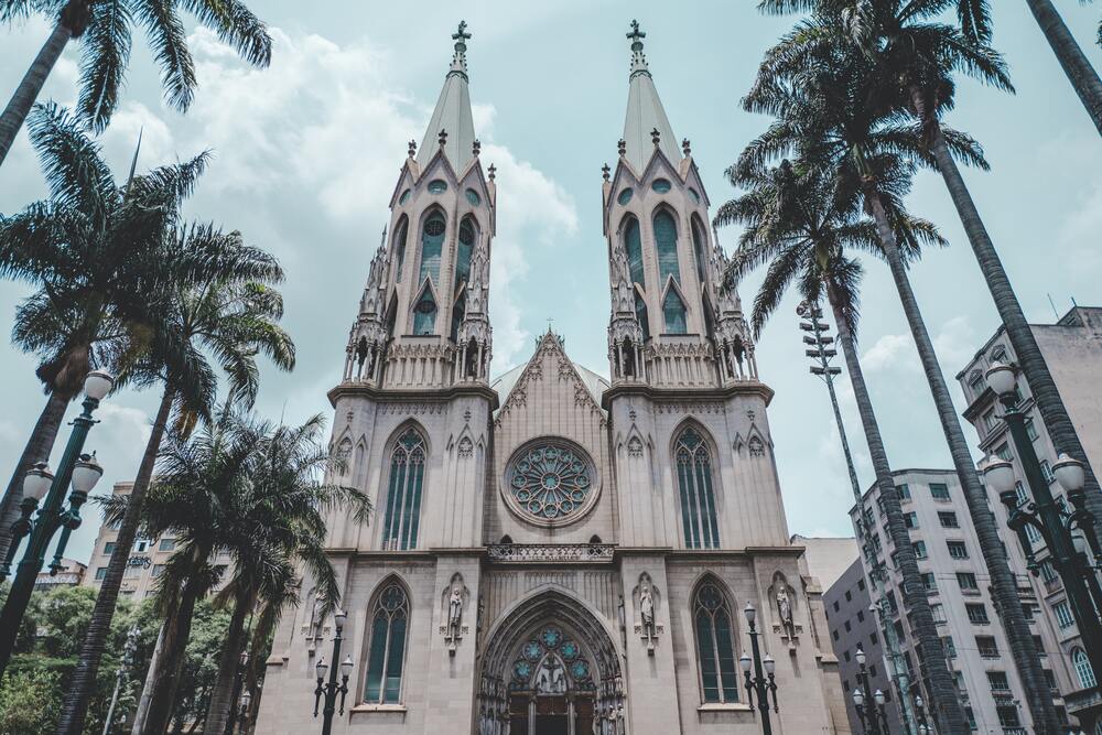 exterior of sao paulo cathedral framed by palm trees