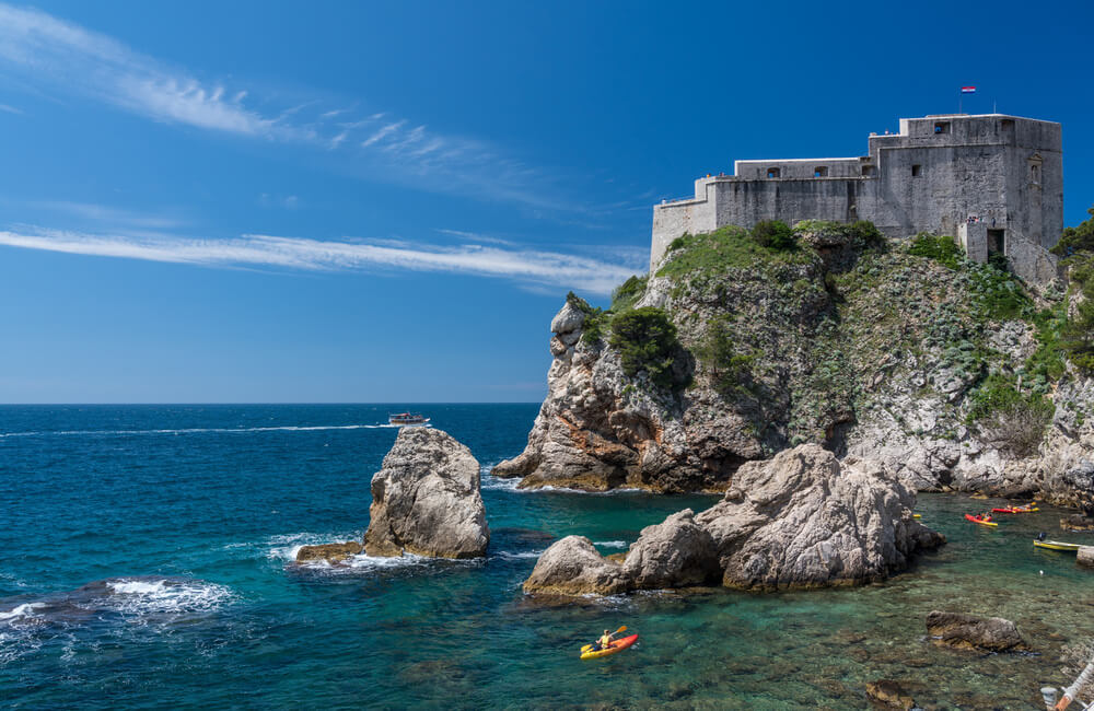 person sea kayaking in dubrovnik