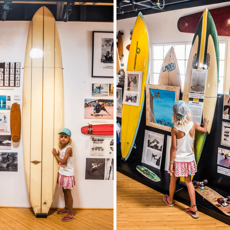 girl looking at surfboards at the Surfing museum in Huntington Beach