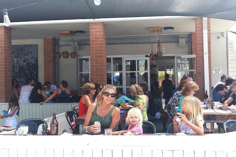 woman and kids sitting outside with drinks at BSKT cafe, Gold Coast, Queensland