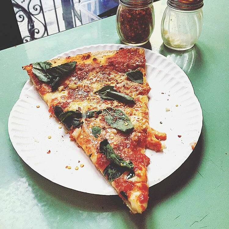 slice of Artichoke Pizza on the table