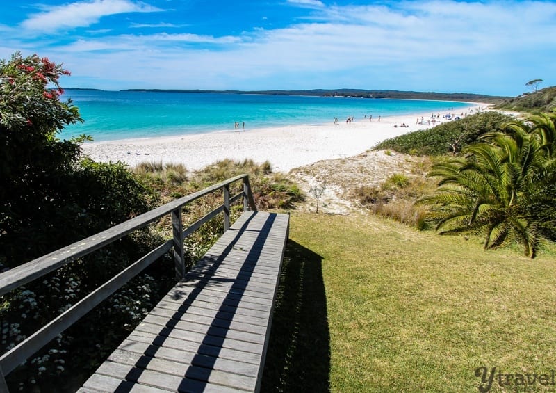 a pathway leading onto a beach