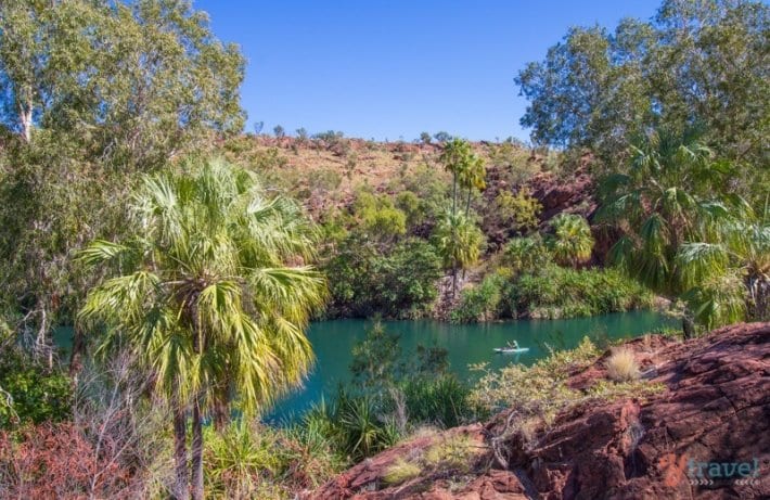 cliffs and trees next to water