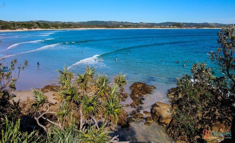 waves rolling into beach at the pass