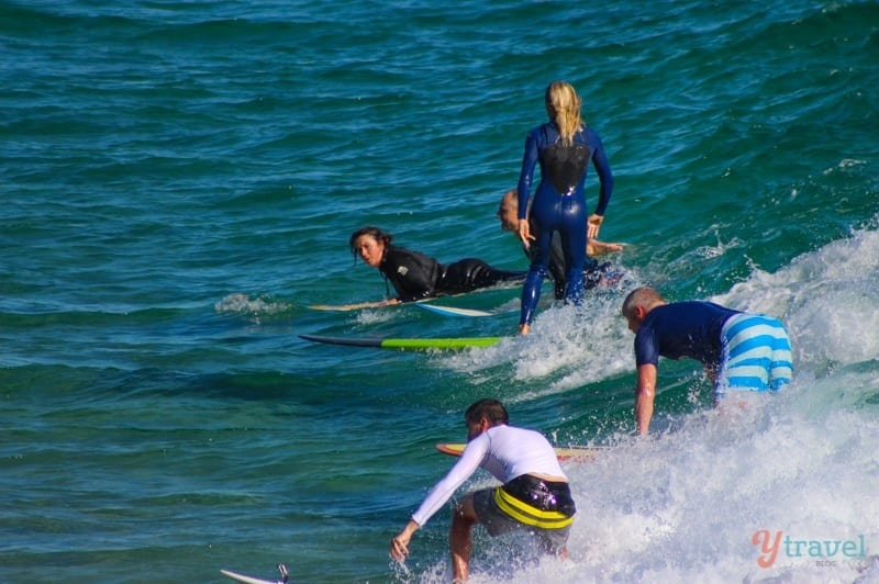 surfers riding the waves at The Pass