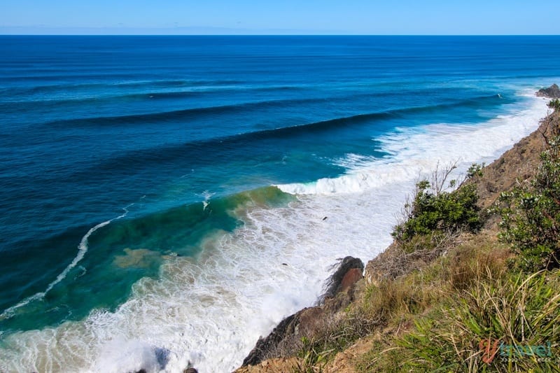 waves rolling into cliffs