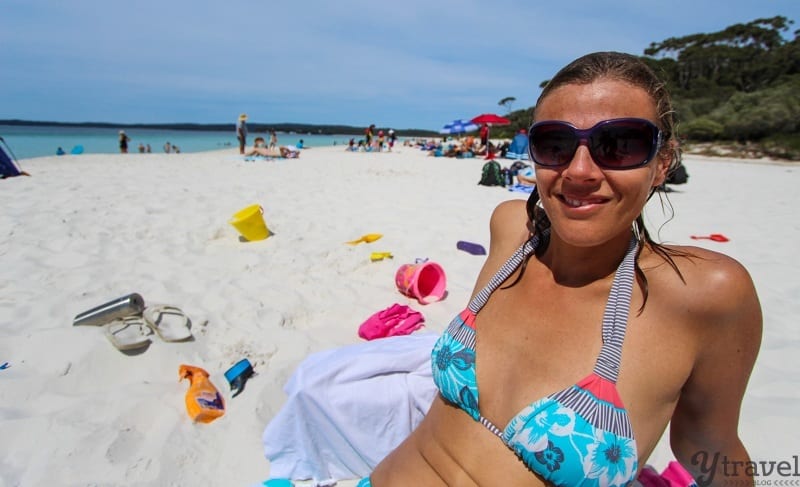 A woman sitting at a beach