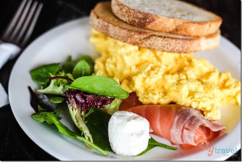 plate wtih salmon and scrambled eggs and toast