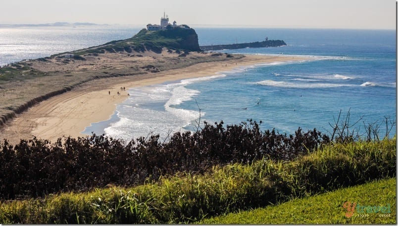 Nobby's Head with lighthoues on it and wide sweeping beach