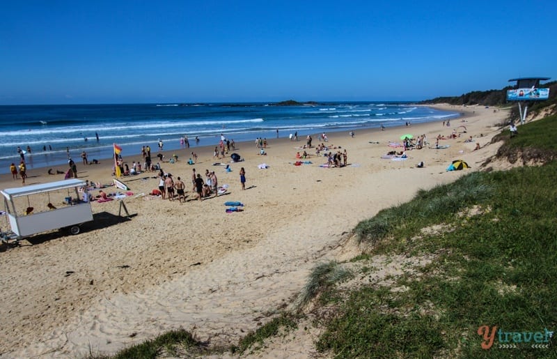 people sitting on Sawtell Beach,