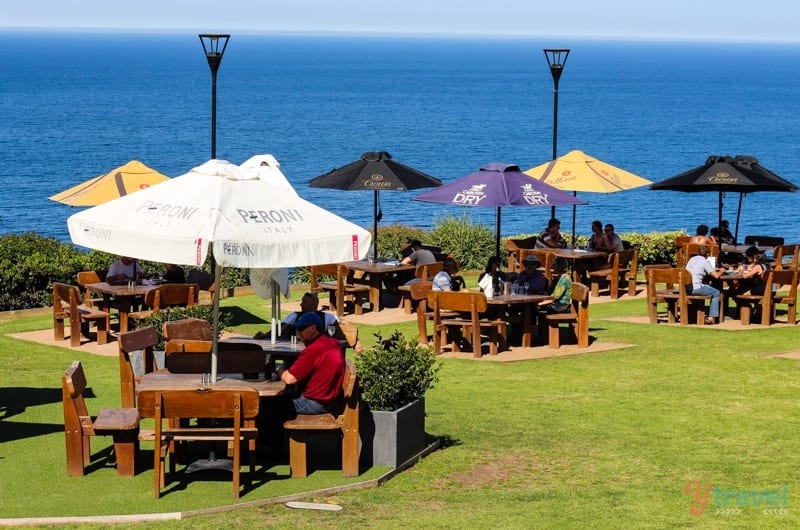 tables and chairs on grass on cliff Scarborough Pub Grand Pacific Drive