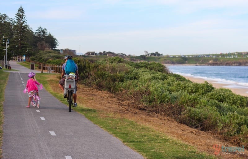 man and girl riding along Bike path Wollongong