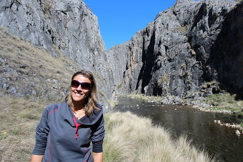 woman standing in front of a canyon