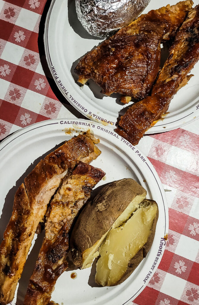 plate of bbq pork ribs and roast potato