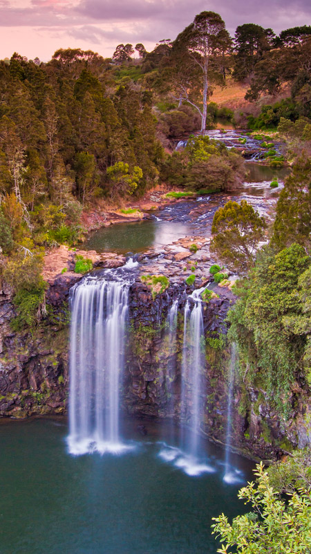 Dangar Falls spilling over cliff at sunset