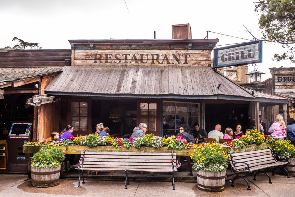 patio lined with flower pots of the ghost grill