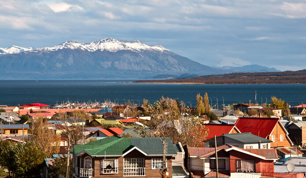 snow capped moutnains on edge of water