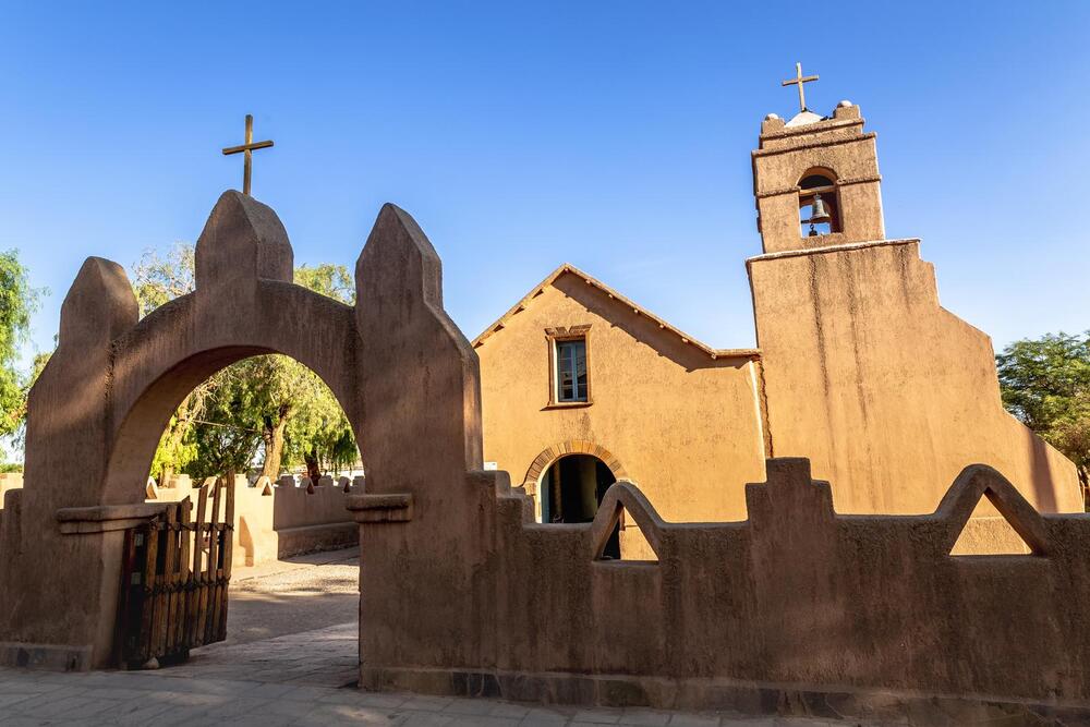 orange adobe Church of San Pedro de Atacama,