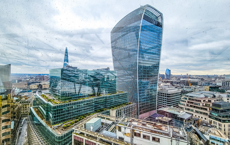 Sky Garden glass building rising above london skyline with the Shard in the distance