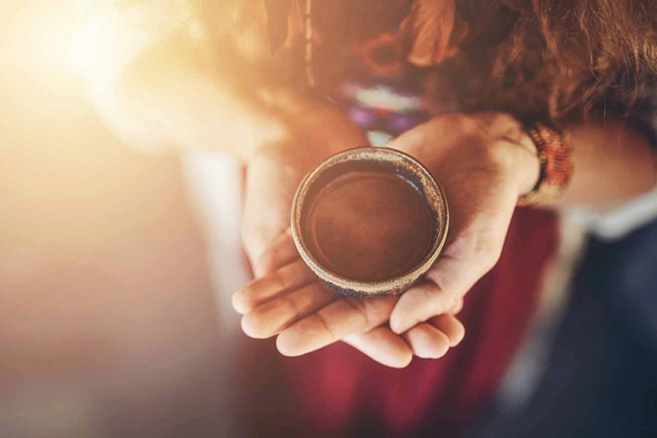 woman holding cacao in a cup