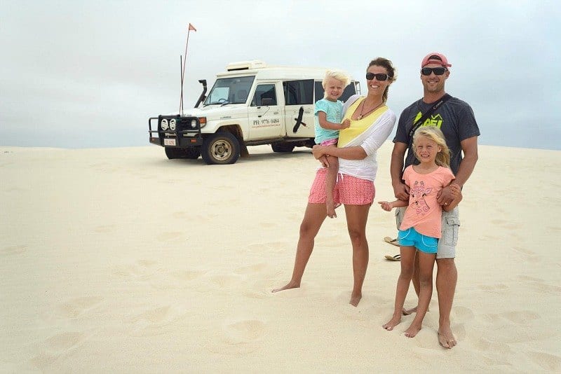 people standing on the beach