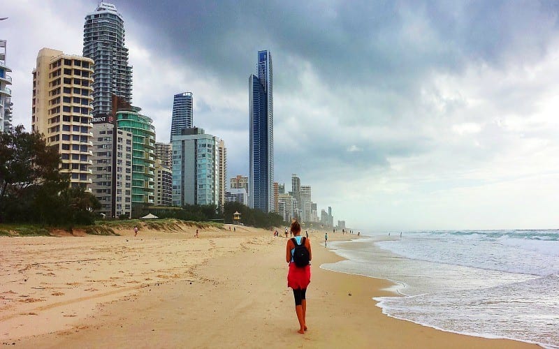 woman waling on beach at surfers paradise