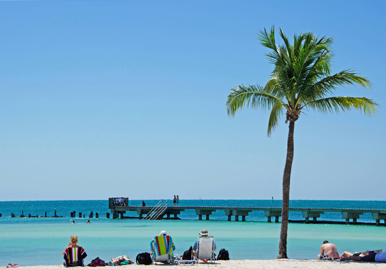 people chilling and enjoying the sun at the beach